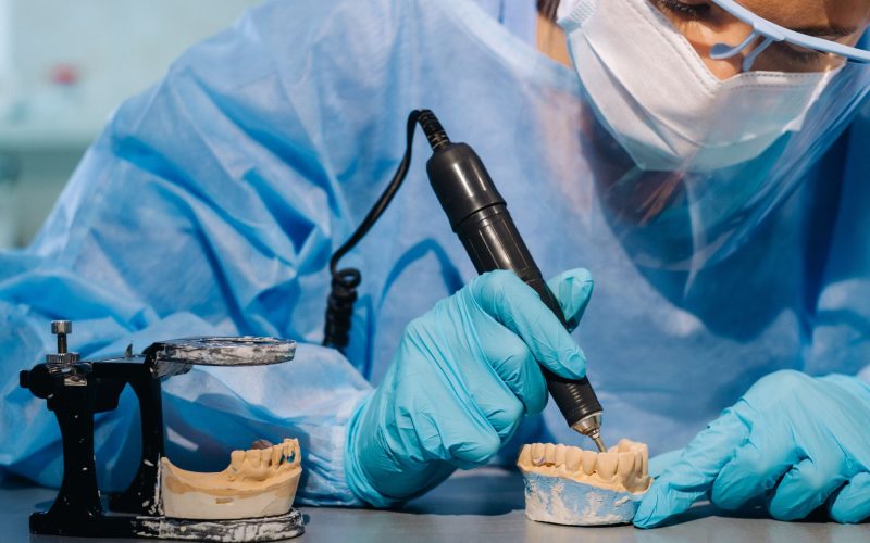 a-dental-technician-in-protective-clothing-is-work-2025-03-27-02-27-24-utc