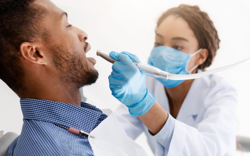 african-woman-dentist-drilling-patient-teeth-clos-2025-03-18-17-44-38-utc